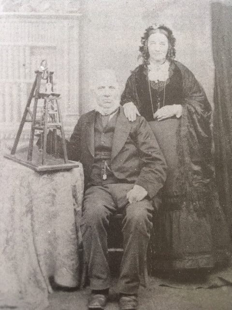 A black and white picture showing John king and his wife